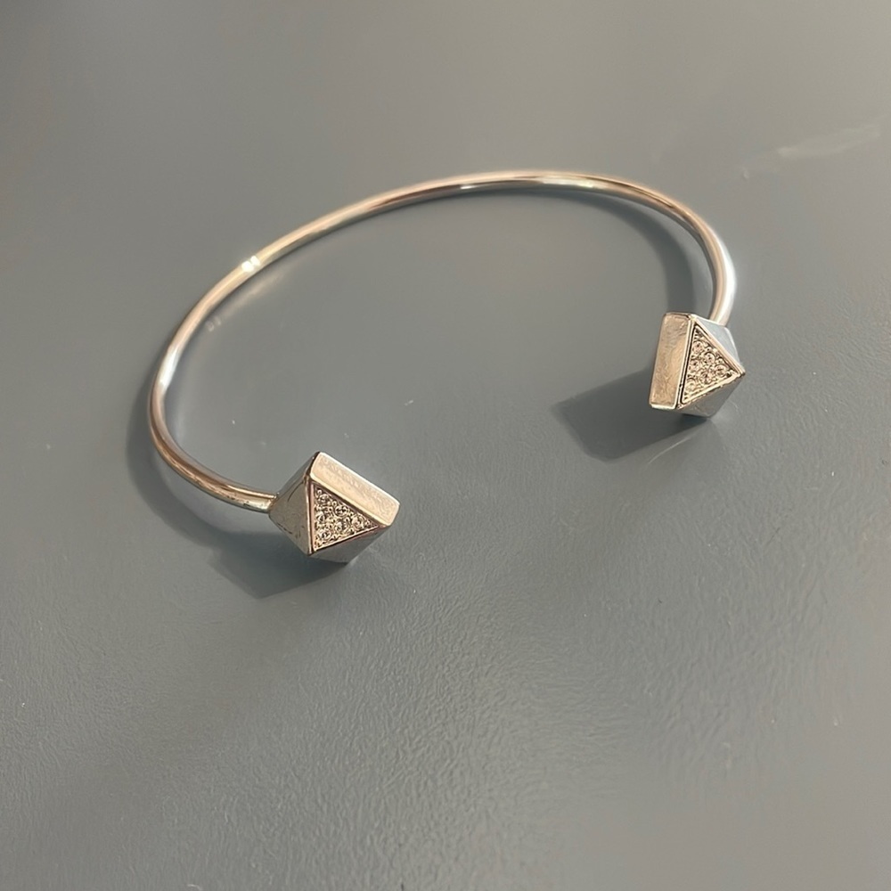 Silver tone cuff style bangle bracelet